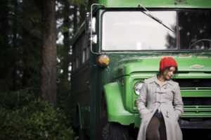 Romina infront of bus